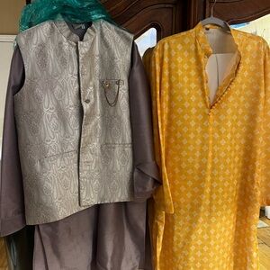 4 items. 2 kurtas, 2 pair of shoes. Yellow slip-on and cream colored mules.